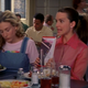 Charlotte with a self-help book and an EXTREMELY shiny blouse in season 3.